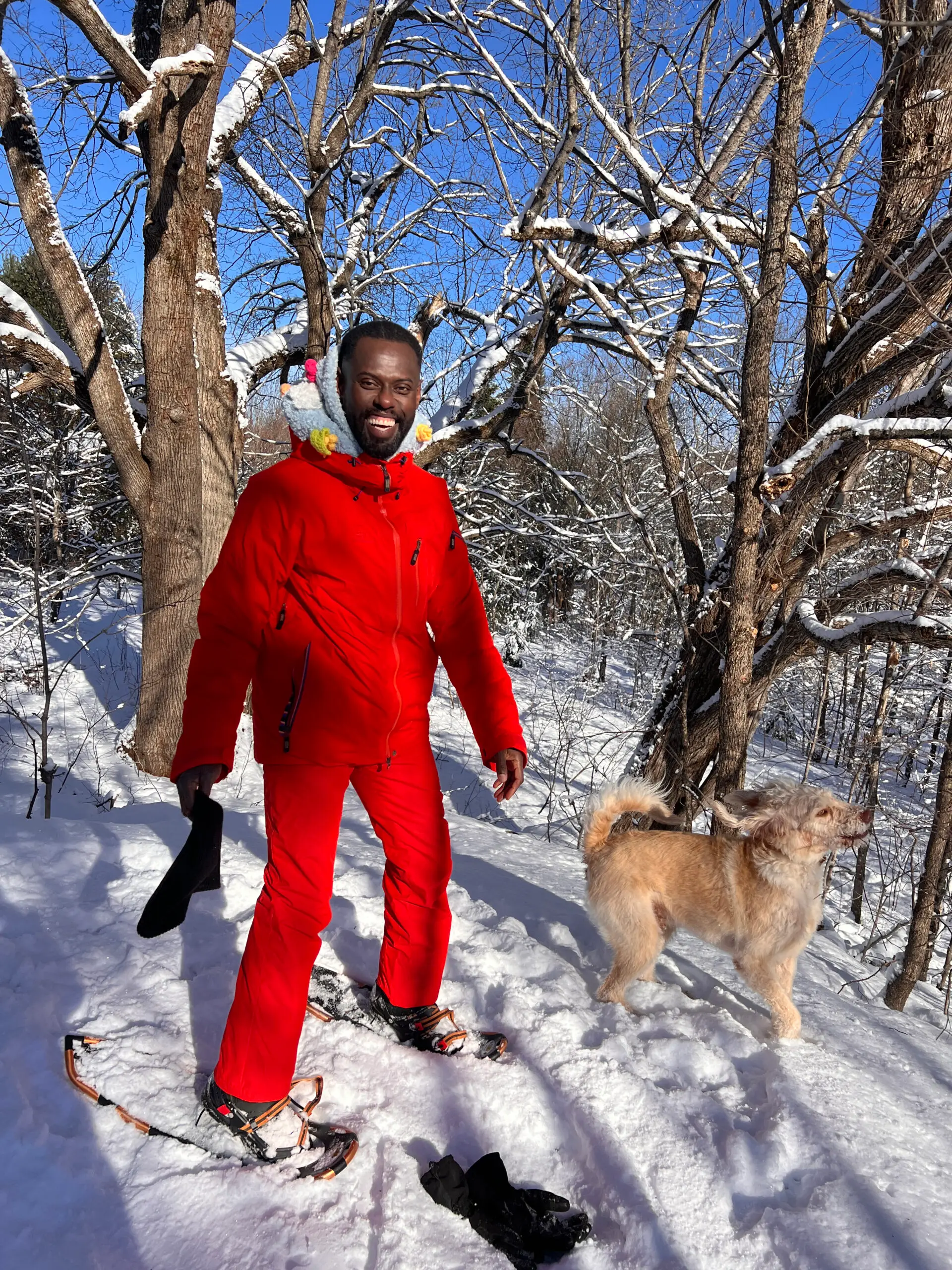 Pierre Antoine Alexandre bundled against the cold with Steve the dog in deep snow at THE SON